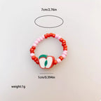 Colorful fruit charm beaded ring by Shopimist featuring vibrant fruit-shaped beads and intricate beading details.