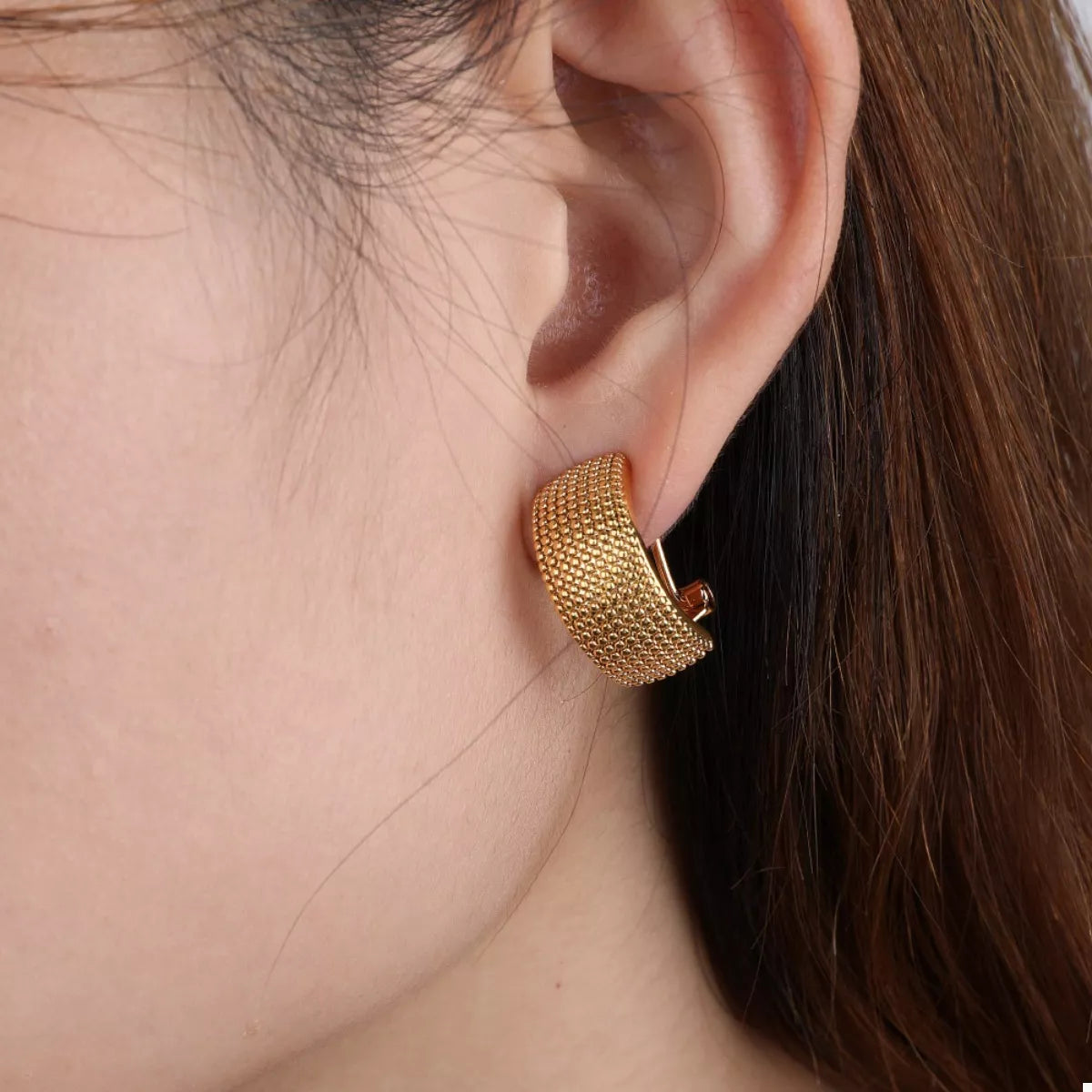 Gold-plated textured wide band hoop earrings from Plush Fashion Hub, featuring a bold and stylish design.