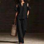 FitiqueFit V-neck short sleeve top and straight-leg pants set with ripped detail and pockets in a solid color, casual two-piece outfit.