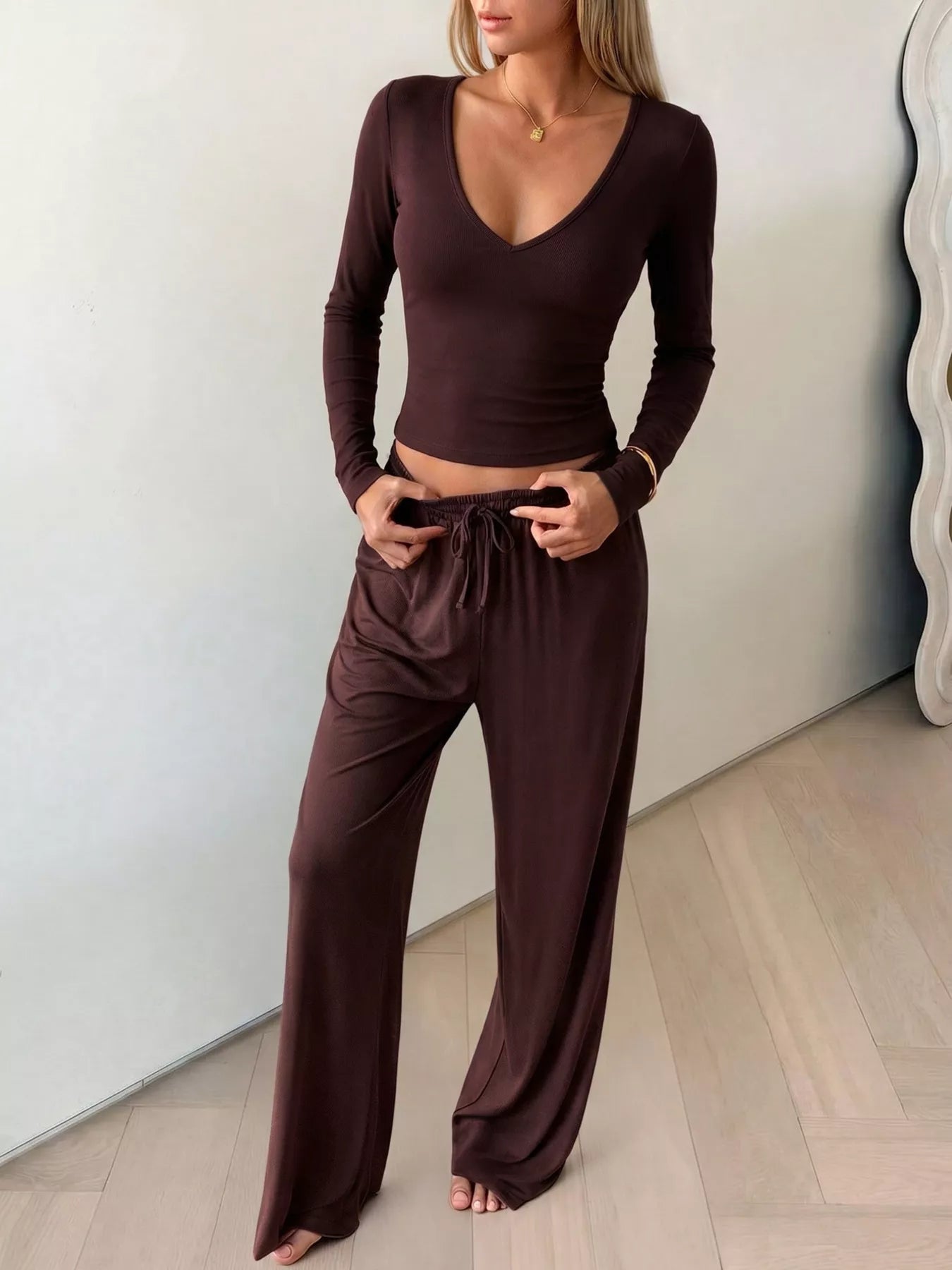 Plush Fashion Hub matching set with V-neck long sleeve top and wide-leg pants, stylish and comfortable loungewear ensemble.