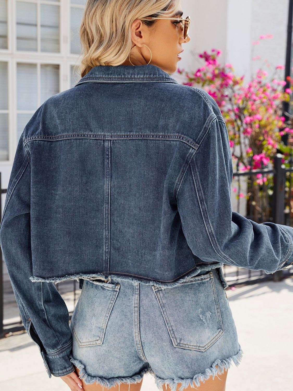 Denim button-up long sleeve jacket with pockets from Plush Fashion Hub, styled on a model showing the front view of the jacket.