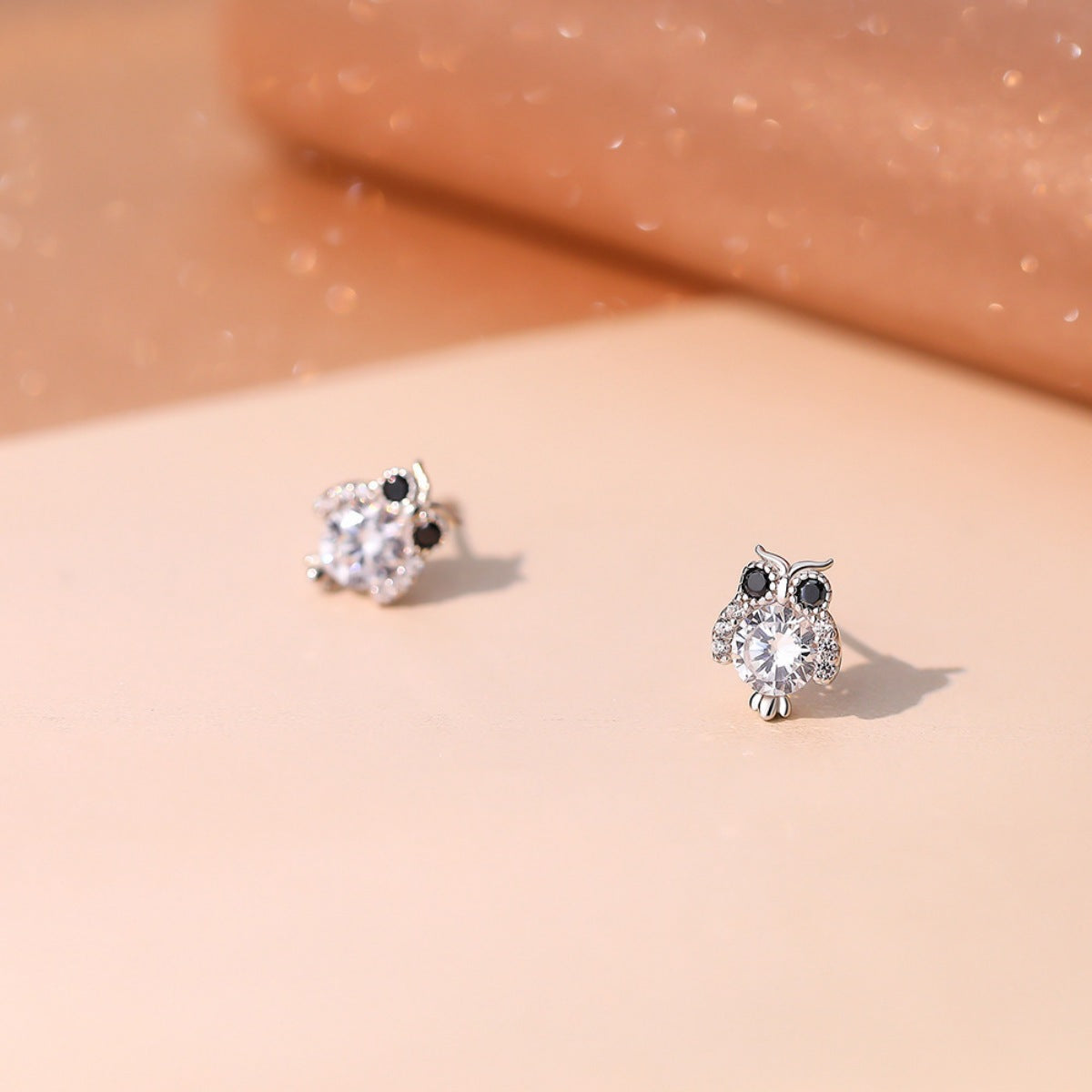 Pair of gold owl stud earrings by Plush Fashion Hub, featuring detailed owl designs for stylish accessory wear.