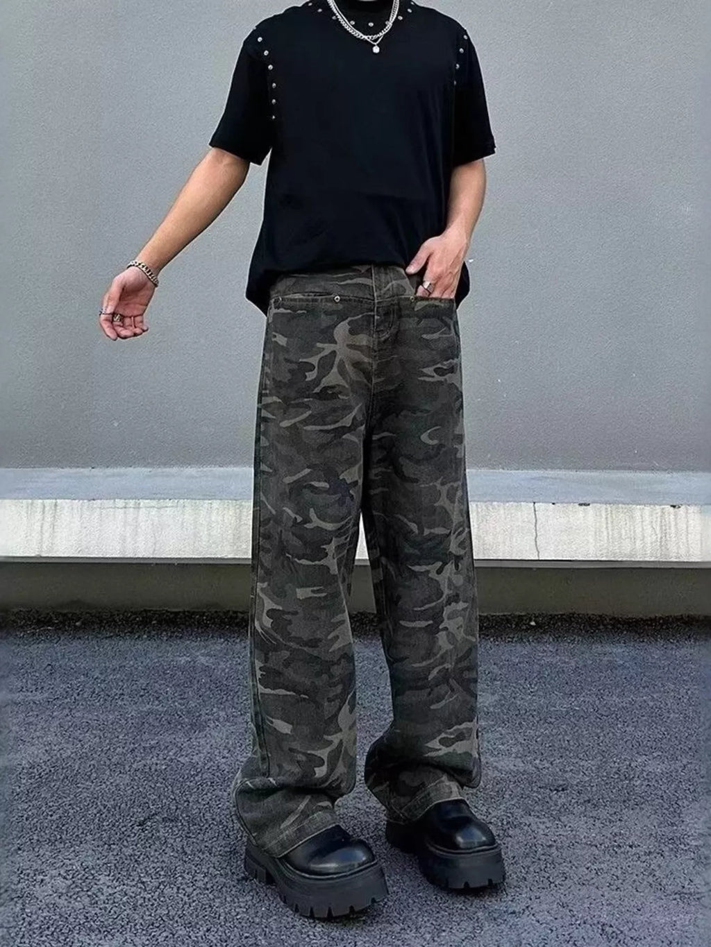 Men's camo print loose fit jeans in plus size, trendy camouflage design, casual bottoms by Trendsi, shown in the image.