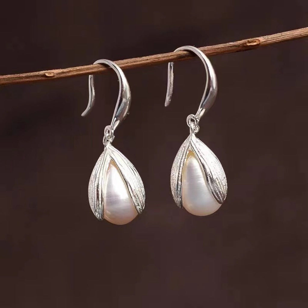 Sterling silver drop earrings featuring elegant, polished design with hooks, crafted by Shopimist for stylish wear.