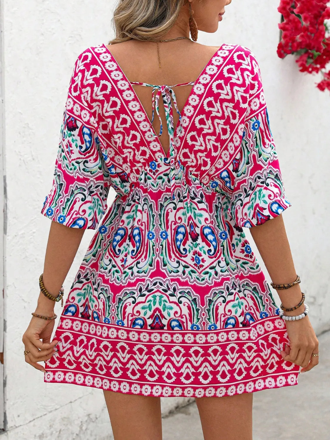 Printed tie-back half sleeve mini dress from Plush Fashion Hub featuring a stylish design and comfortable fit.