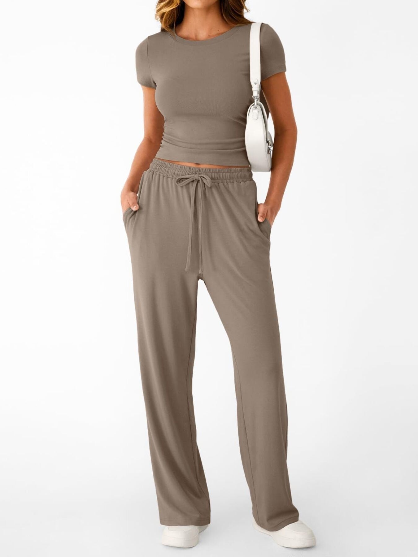 Women's round neck short sleeve T-shirt and drawstring lounge set by Trendsi, featuring a comfortable 2-piece casual outfit.