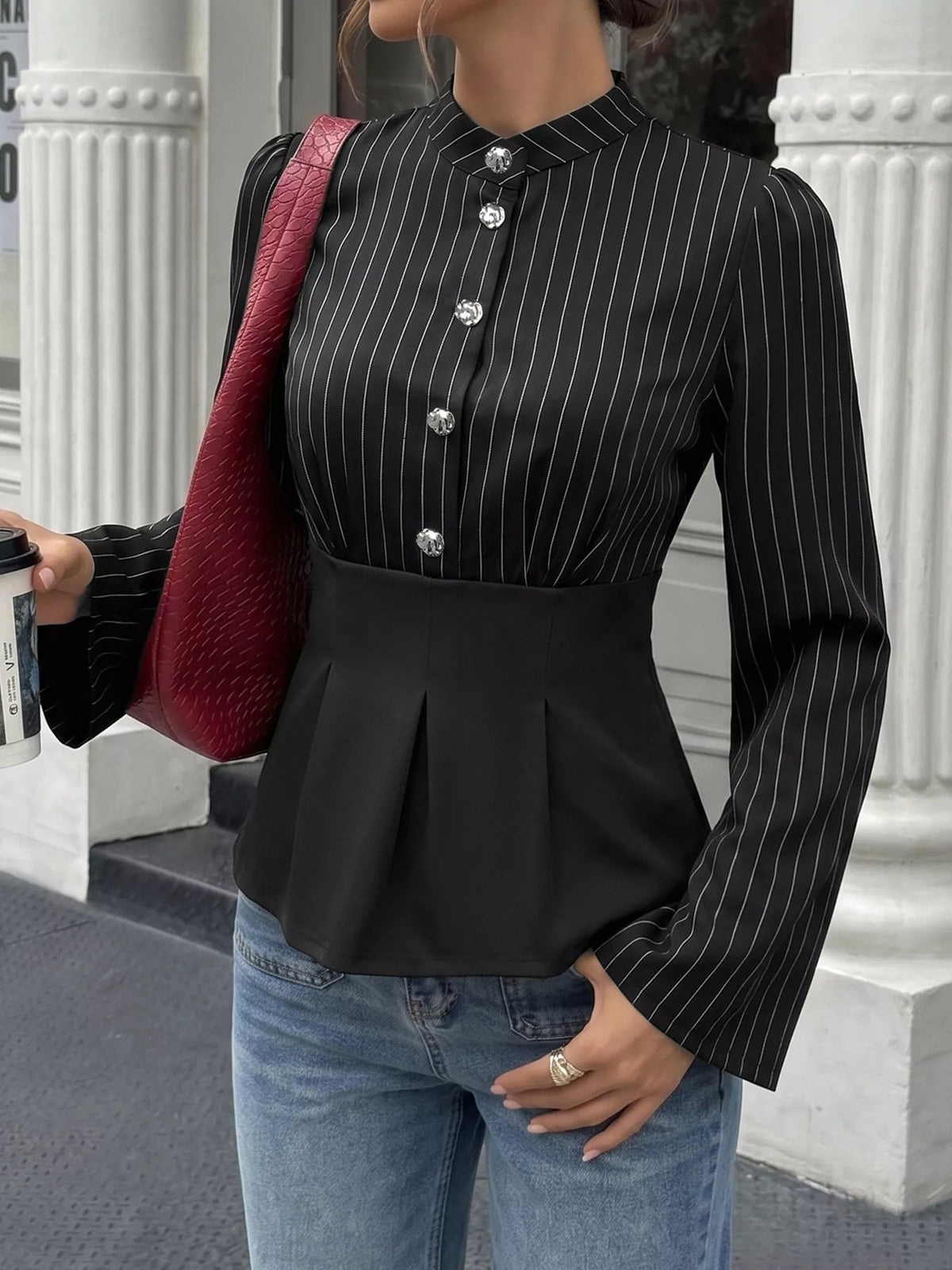 Striped long sleeve peplum blouse for women by Trendsi, featuring a fitted waist and stylish design, shown on a mannequin.