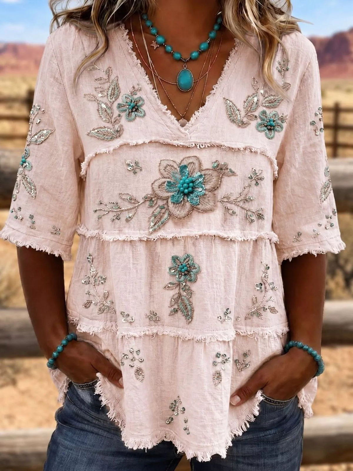 Plus size floral raw hem V-neck blouse by Trendsi, showing the full size shirt with a V-neck and floral pattern