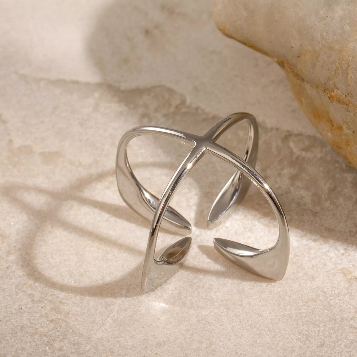 Stainless steel crisscross open ring from Plush Fashion Hub, showcasing a sleek, modern design with interwoven bands.