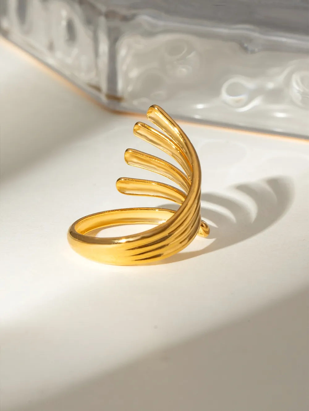 18K gold-plated stainless steel open ring with irregular line design, showcasing a sleek and modern jewelry piece.
