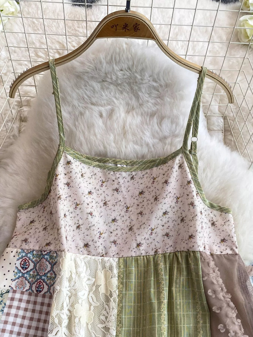 Boho patchwork lace-trimmed A-line tiered dress by Trendsi, featuring colorful fabric patches and flowing silhouette.