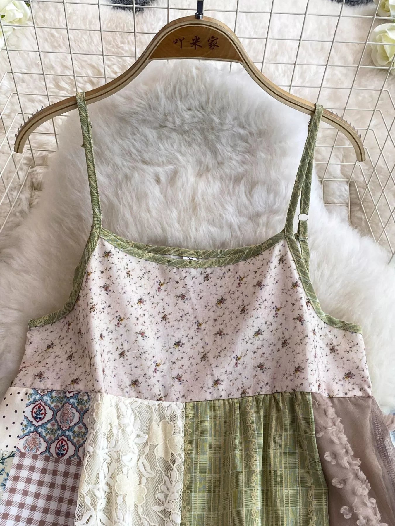 Boho patchwork lace-trimmed A-line tiered dress by Trendsi, featuring colorful fabric patches and flowing silhouette.