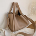 LadyShow.Store Kira handbag with sleek design, featuring a structured shape, top handles, and stylish exterior in neutral tones.