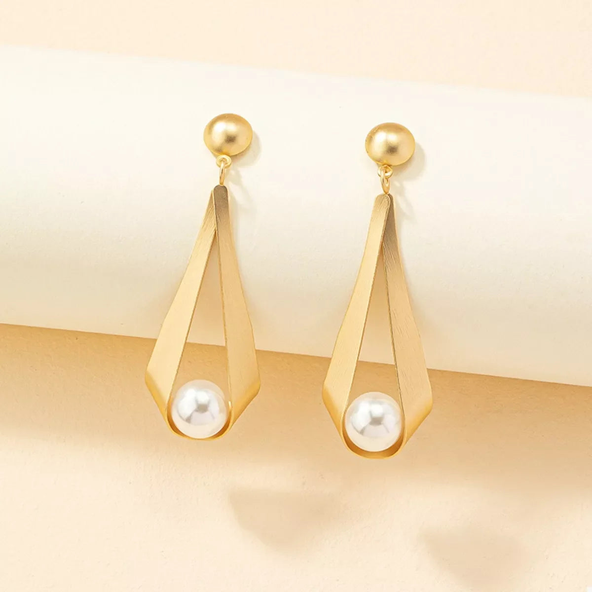 18K gold-plated pearl drop earrings with elegant dangling pearls, featuring a sophisticated and timeless jewelry design.