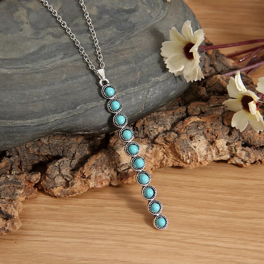 Vintage style beaded bar necklace from Shopimist featuring colorful beads on a delicate chain.