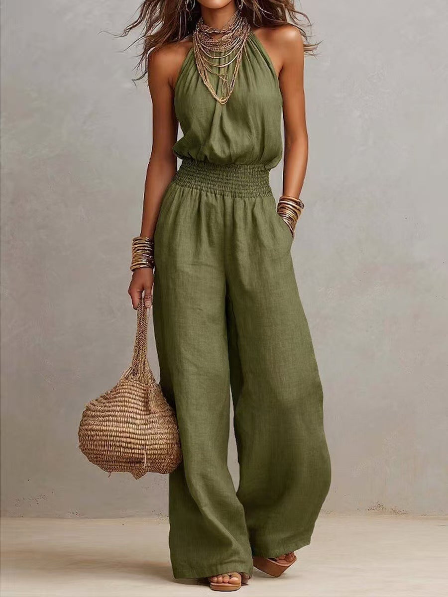 Women's black halter-neck backless wide-leg jumpsuit by Plush Fashion Hub, stylish streetwear with a solid color design.