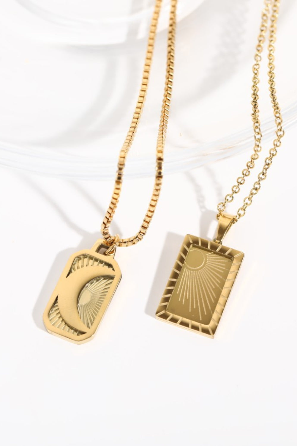 Stainless steel 18K gold-plated necklace with a sleek, polished chain, displayed on a white background.