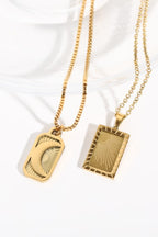 Stainless steel 18K gold-plated necklace with a sleek, polished chain, displayed on a white background.