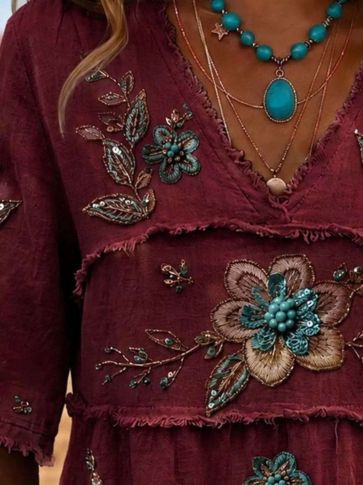 Plus size floral raw hem V-neck blouse by Trendsi, featuring a full-size shirt with a feminine floral pattern and relaxed fit.