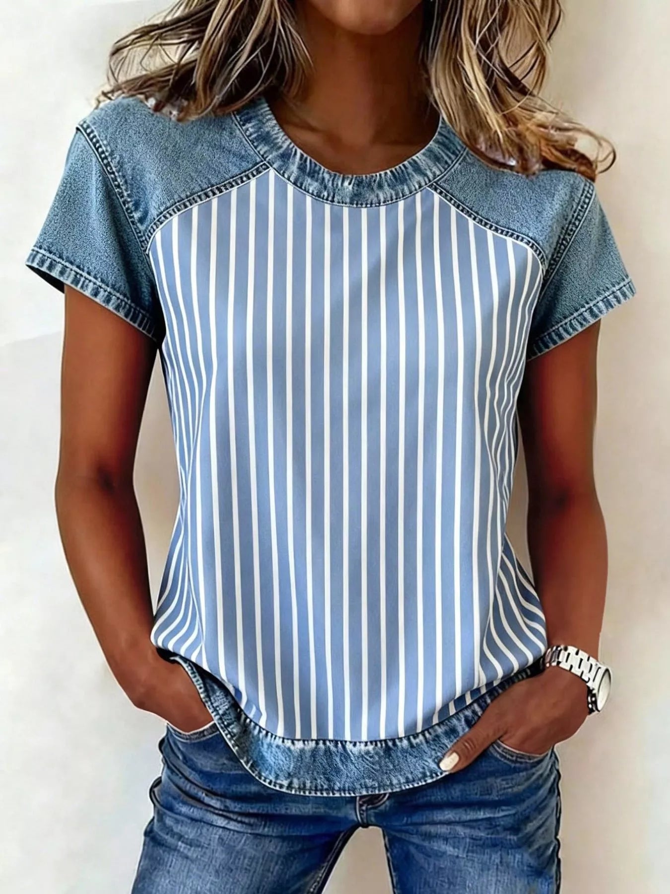 Denim patchwork short sleeve blouse from Plush Fashion Hub featuring mixed denim panels and casual style.