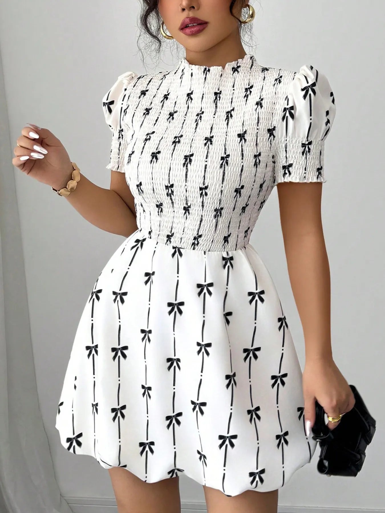 Shopimist smocked bow print short sleeve dress featuring a feminine design with a fitted waist and playful bow details.