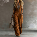 Light beige sleeveless wide-leg jumpsuit with two pockets from FitiqueFit, displayed on a neutral background.
