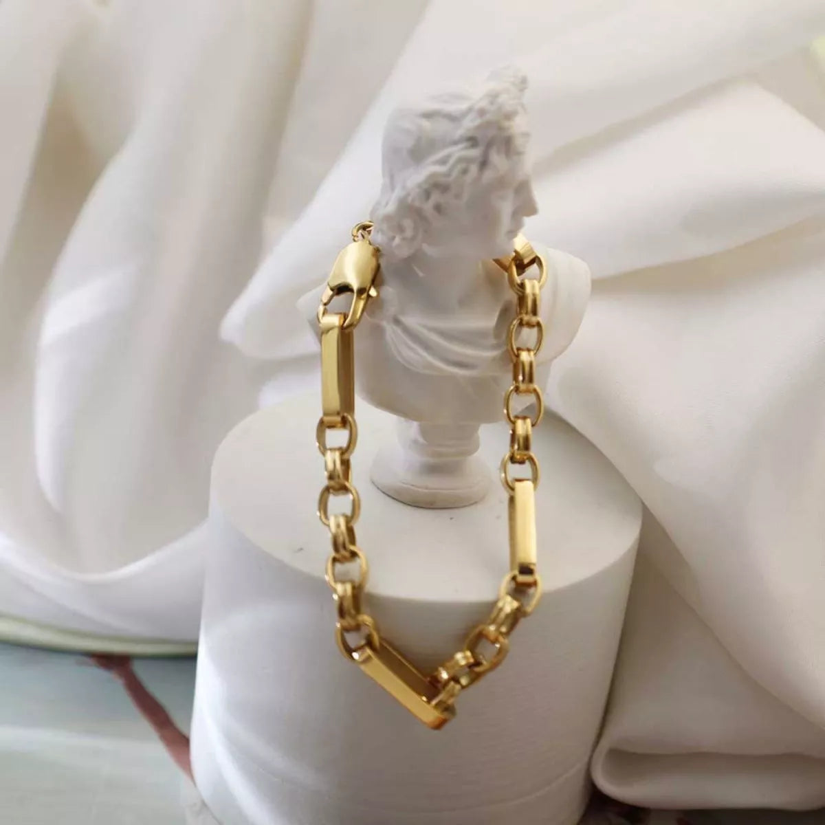 18K gold-plated chunky chain link bracelet from Shopimist, featuring large interlocking links and a shiny gold finish.