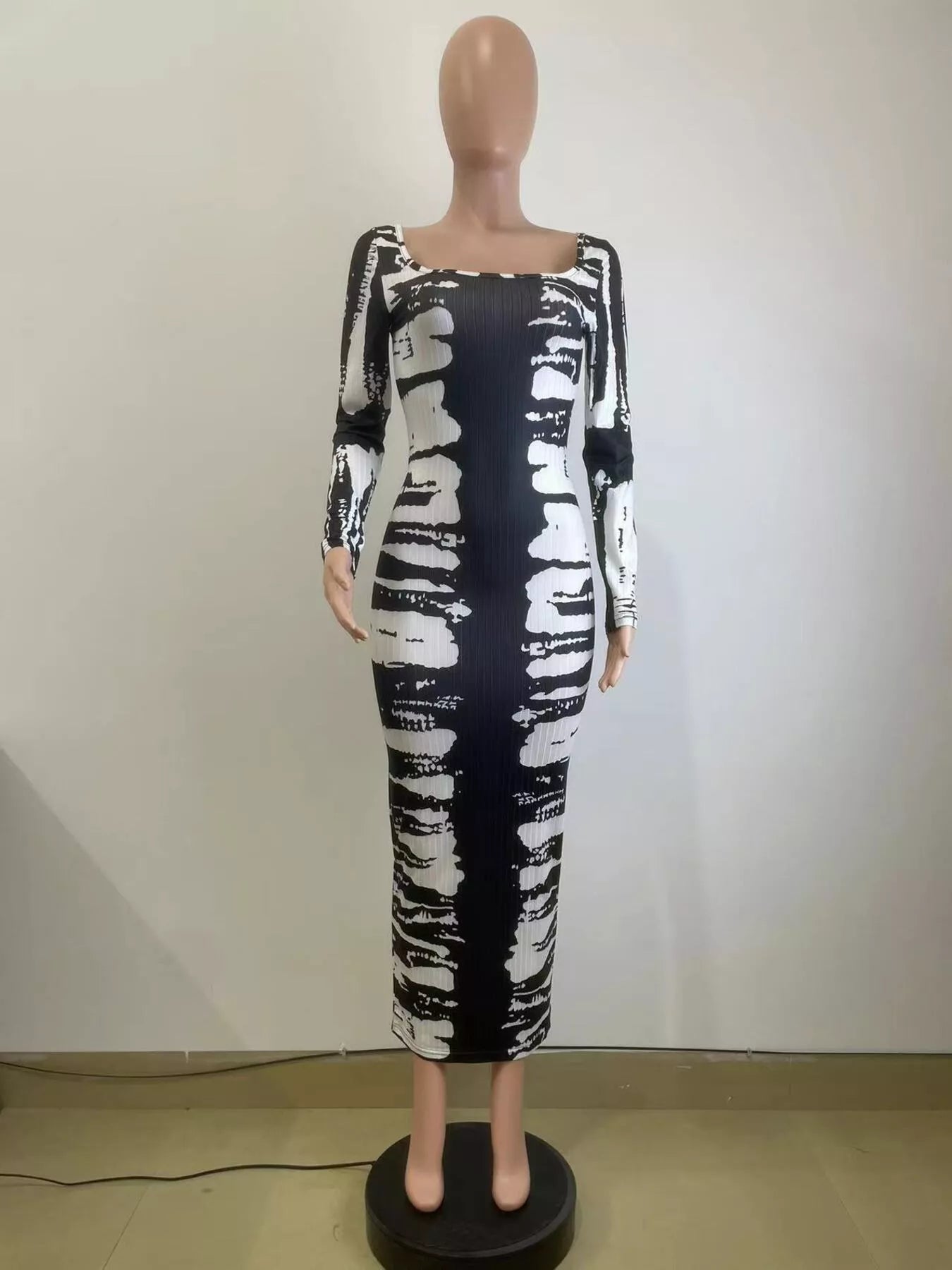 Tie-dye long sleeve maxi dress by Shopimist featuring vibrant colors and a flowing silhouette, perfect for casual or boho styles.