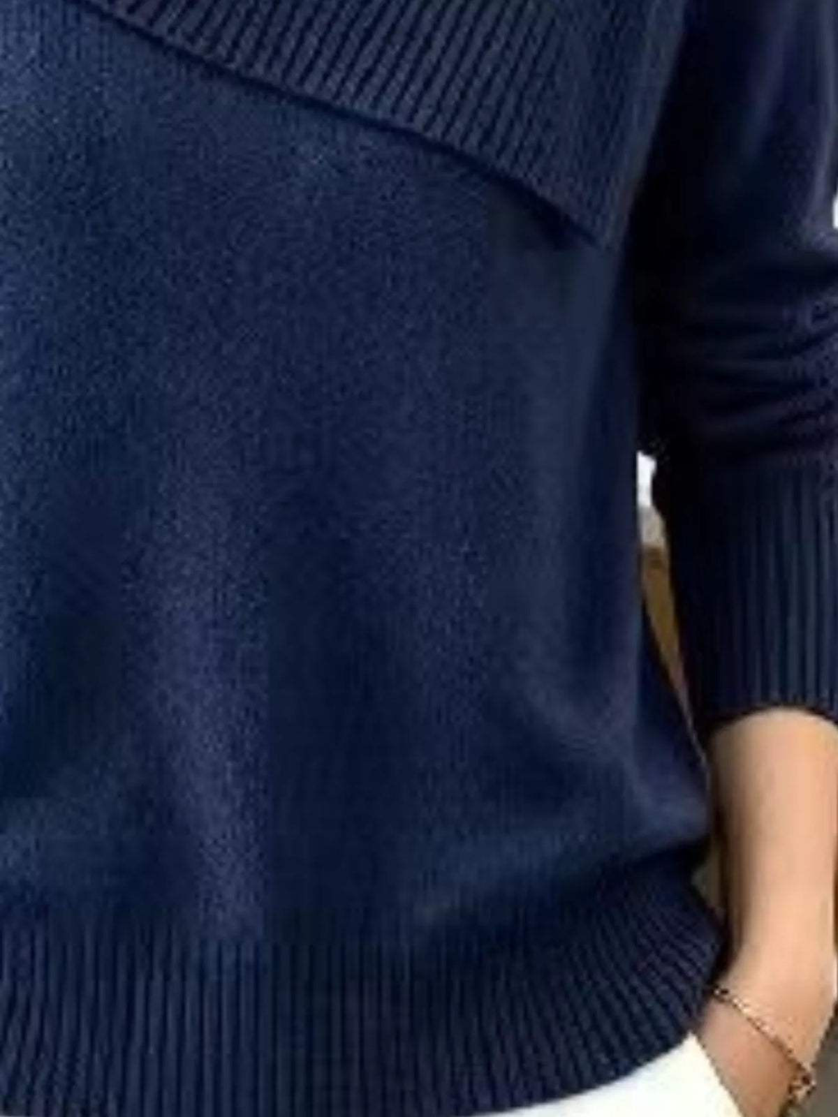 Plus size asymmetric ribbed collar sweater by Trendsi, shown in soft knit fabric with a stylish uneven hem and ribbed collar detail.