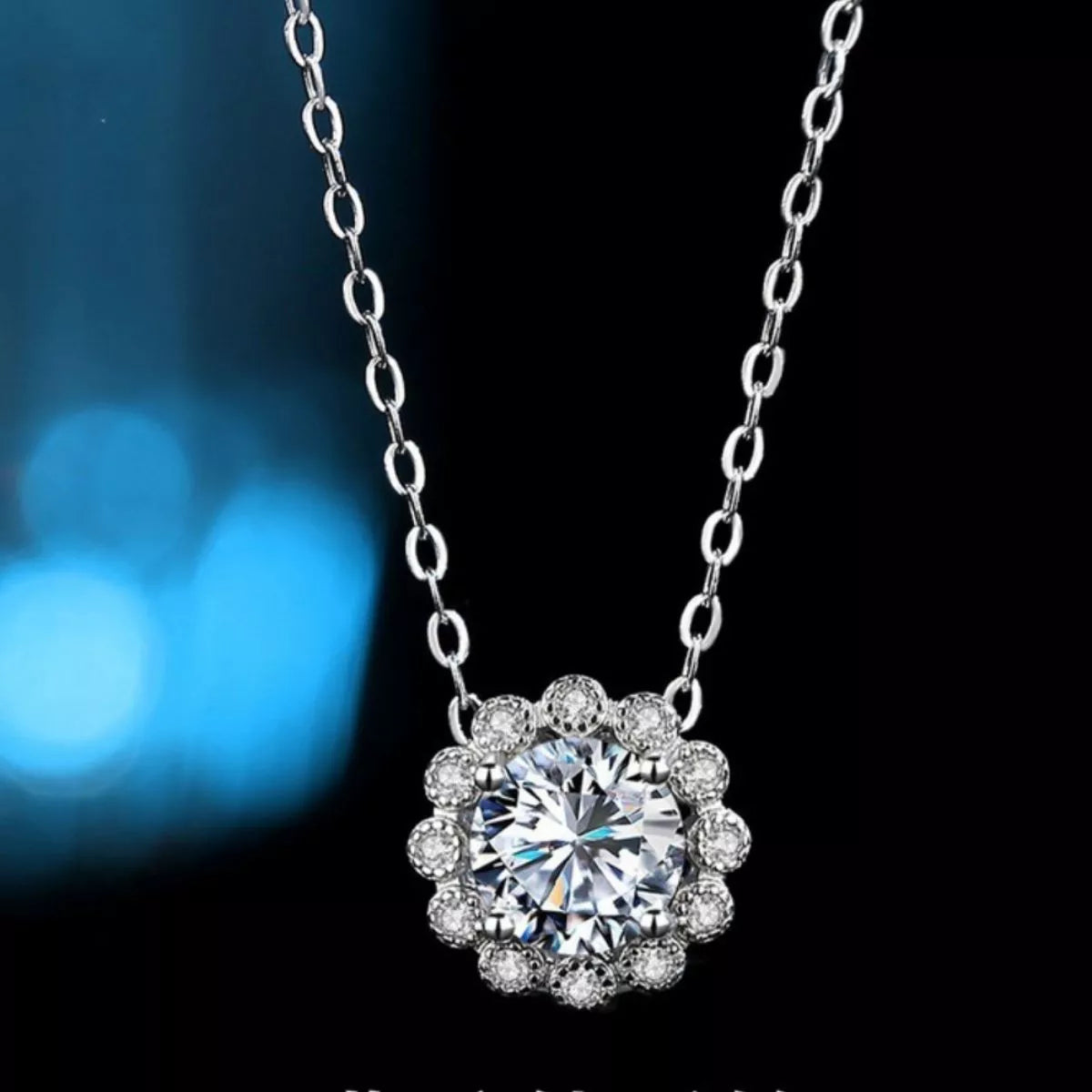 Sterling silver flower necklace featuring a 1 carat moissanite gemstone, with intricate floral design and delicate chain.
