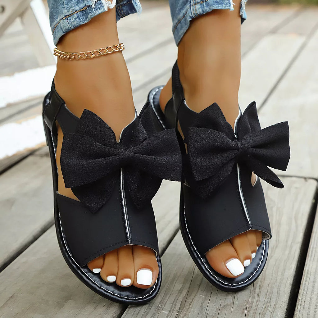 Shopimist open toe bow sandals featuring stylish straps and a comfortable sole, perfect for casual summer wear.