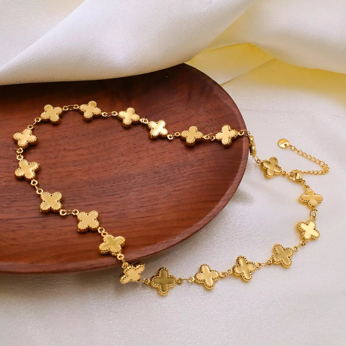 18K gold-plated clover charm necklace with delicate chain, featuring a shiny four-leaf clover pendant for a stylish accessory.