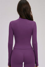 Fitglutes activewear three-piece set including a zip jacket, cross-back sports bra, and leggings for gym and workout.