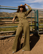 Green satin-lined jumpsuit by Plush Fashion Hub, featuring a sleek fit and stylish design, shown on a model.
