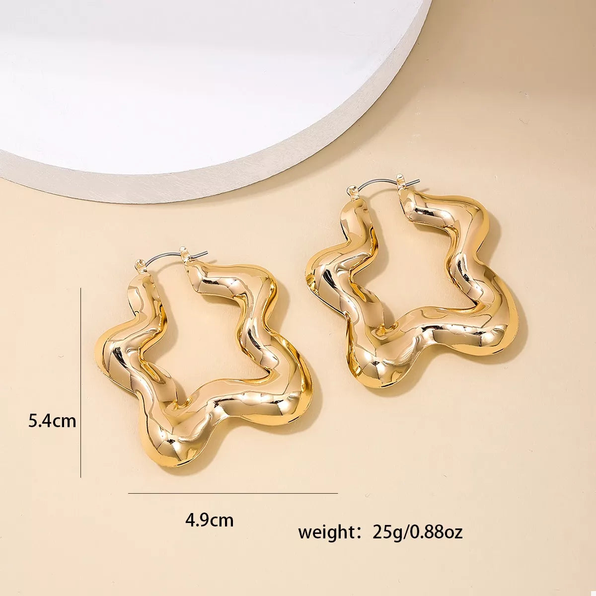Star-shaped hoop earrings from Plush Fashion Hub, stylish jewelry accessory with a modern star design for fashionable look.
