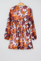 Flowy Marianna floral mini dress by Threaded Pear featuring long sleeves and a relaxed fit, perfect for casual or summer wear.