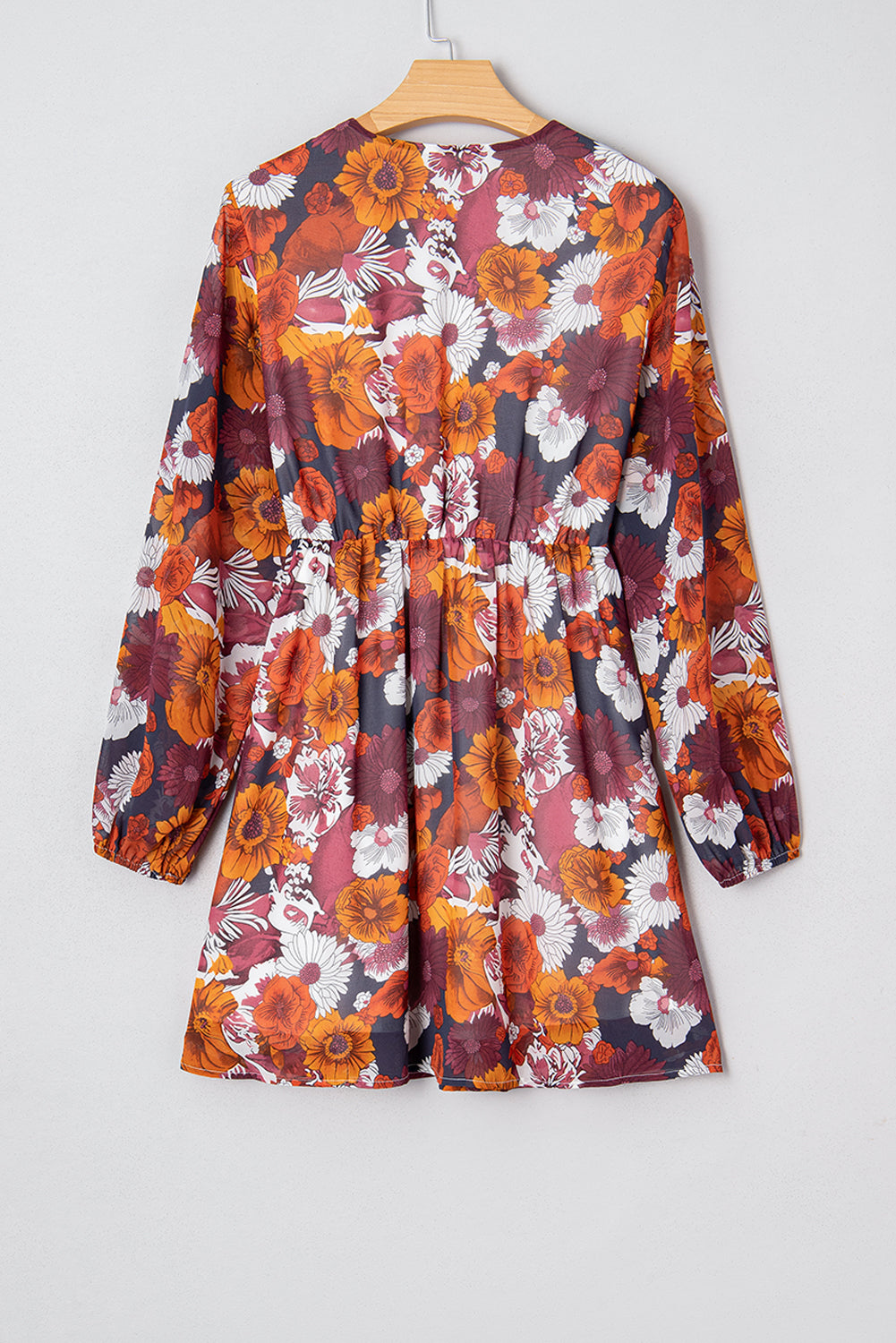 Flowy Marianna floral mini dress by Threaded Pear featuring long sleeves and a relaxed fit, perfect for casual or summer wear.
