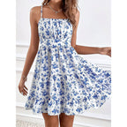 Floral print smocked mini dress with spaghetti straps, slim fit and flowy design by FitiqueFit, perfect for casual wear.