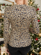 Leopard print long sleeve T-shirt with cutout details from Trendsi, featuring a stylish and trendy animal print design.