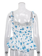 Floral print ruffle hem tank top by Shopimist featuring a sleeveless design and lightweight fabric.