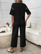 Women's casual two-piece lounge set with round neck top and drawstring pants from Trendsi, comfortable and stylish for relaxed wear.