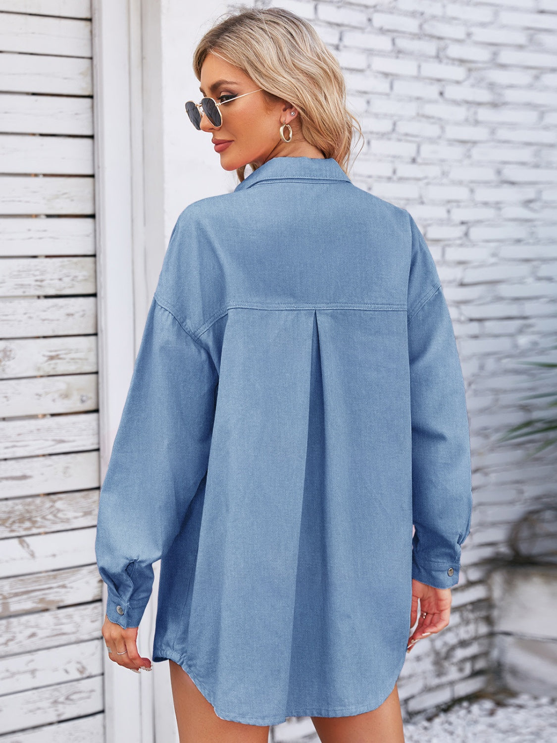 VYSN denim shacket with snap buttons, dropped shoulder design, and pocketed front for a casual, trendy look.