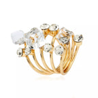 18K gold-plated multi-layered ring with intricate design and shiny finish, showcasing layered band styles and detailed craftsmanship.