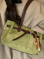 Vintage suede tote bag by Shopimist featuring soft brown suede material and sturdy handles, perfect for everyday use.