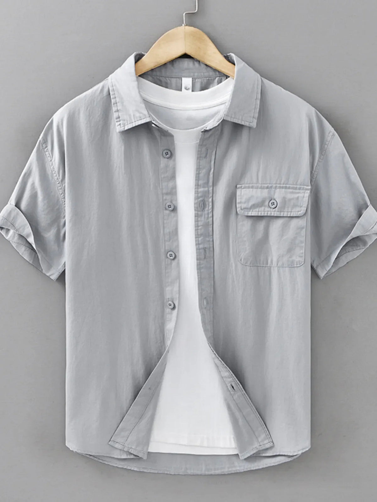 Men's plus size short sleeve button-up shirt by Plush Fashion Hub, displayed with front view and collar details.