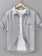 Men's plus size short sleeve button-up shirt by Shopimist, featuring a casual fit and classic collar, shown on a model.