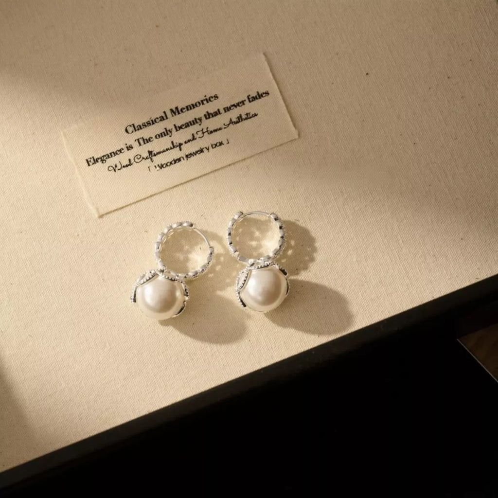 Pearl hoop earrings with zircon accents and gold-tone finish, stylish jewelry featuring elegant pearl and sparkling details.