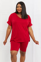Women’s burgundy brushed V-neck lounge top and biker shorts set, comfortable casual apparel from Trendsi.