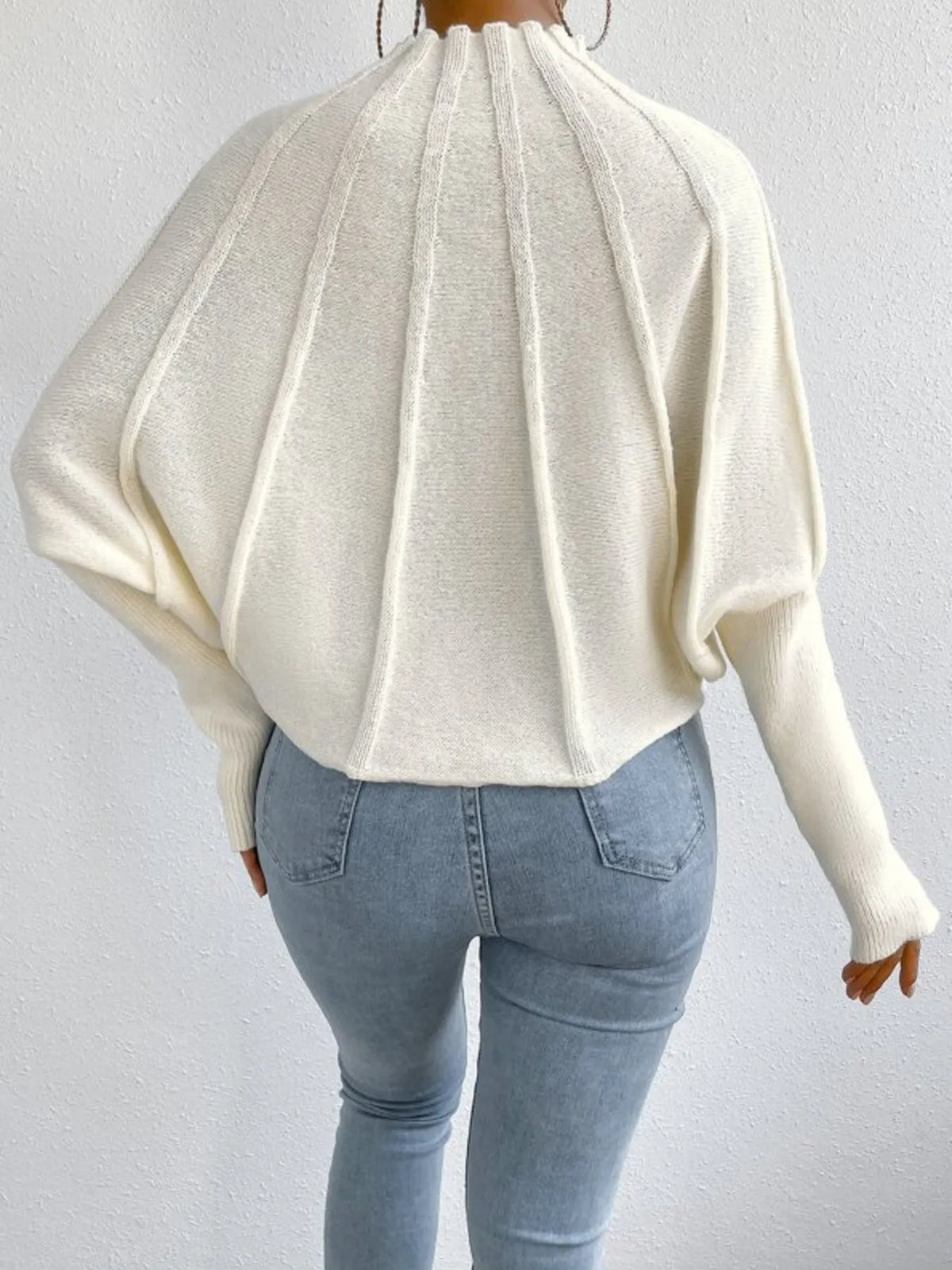 Ribbed mock neck long sleeve sweater by Trendsi, featuring a fitted design and textured knit fabric in a neutral color.