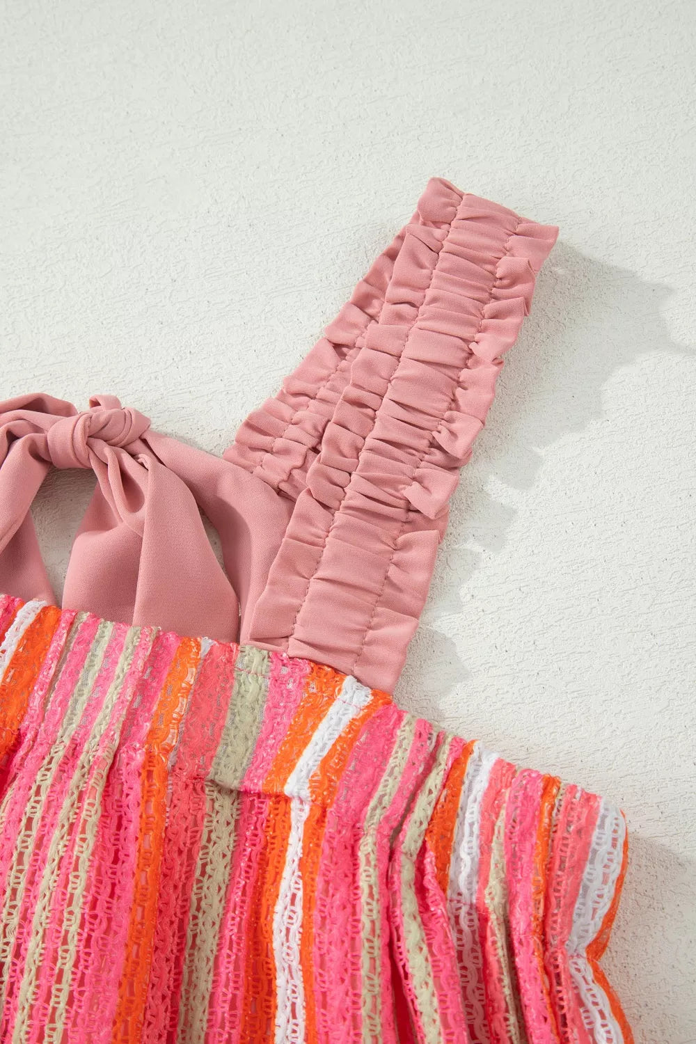 Flowy Stripe Ruffled Maxi Dress with ribbon knot details from Plush Fashion Hub, perfect for vacation or summer wear.